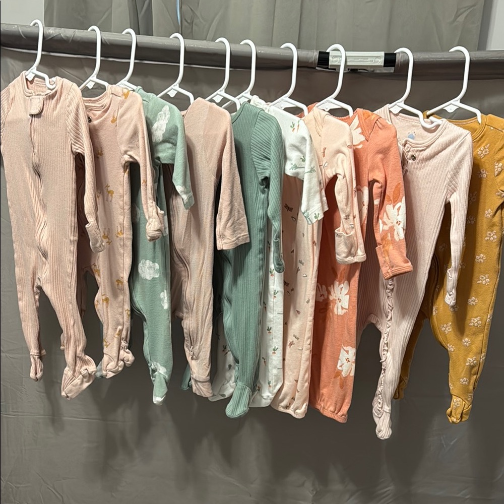 Assorted Baby Onesies in Pastel and Floral Patterns